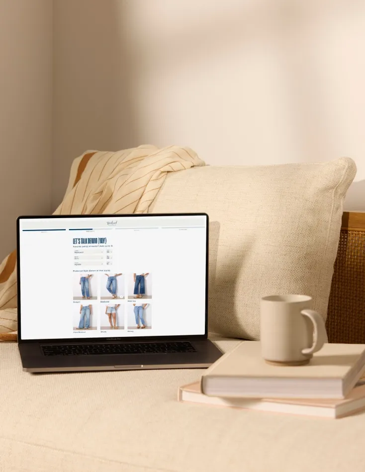 personal styling service: A laptop displaying an online wardrobe selection tool, showing how easy it is to shop from home with a personal styling service.