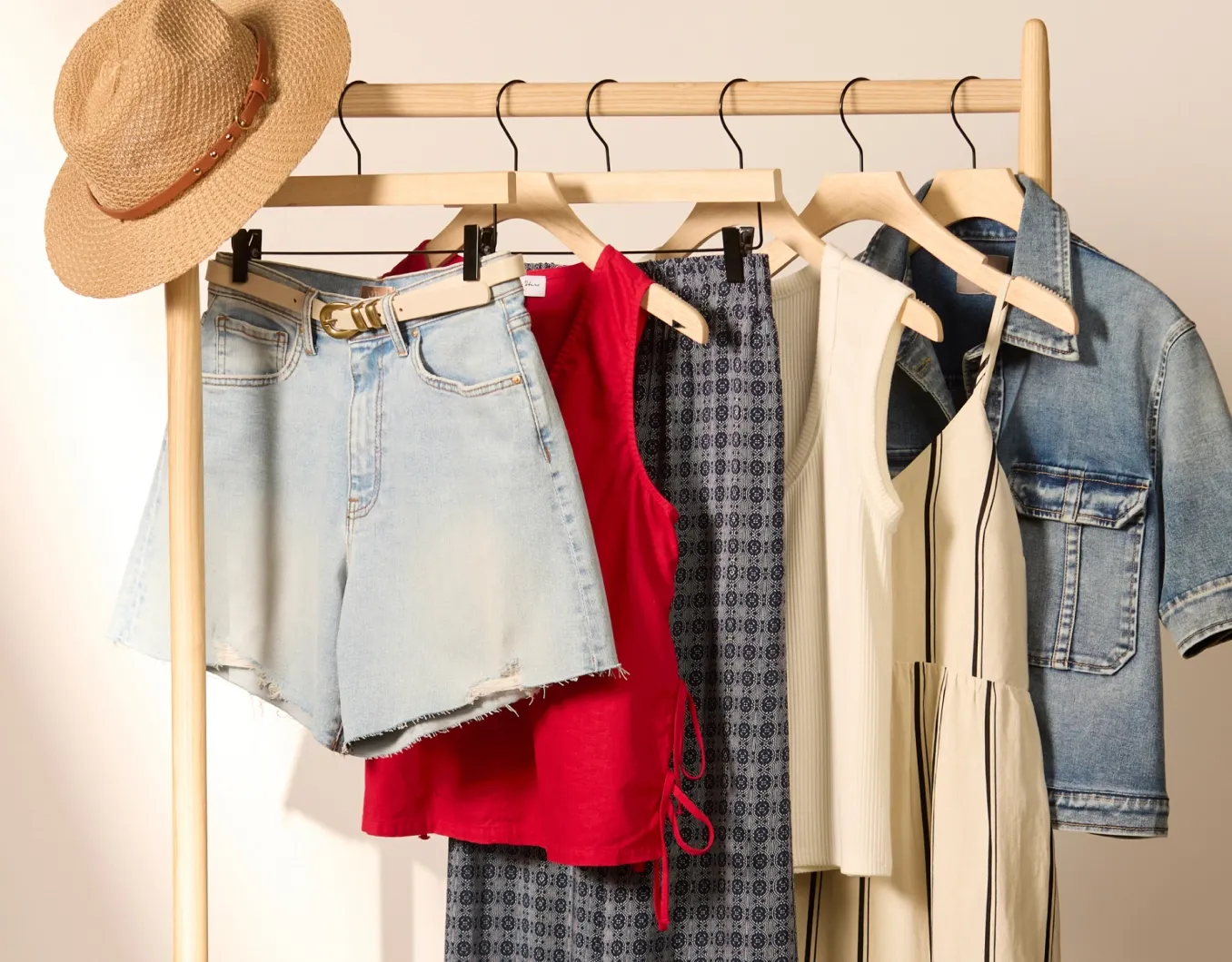 personal styling service: personal styling service: A stylish selection of outfits and accessories on a clothing rack, curated by a personal styling service for versatile wardrobe options.